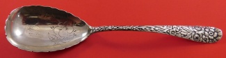 Berry Spoon scalloped edge  w/ flower design in bowl  8 1/2
