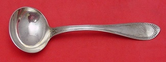 Gravy Ladle retailed by J. E. Caldwell  pure coin  7 1/2