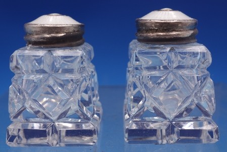Salt and Pepper Shakers w/  white enamel tops and glass/  1 3/4