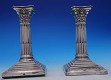 Candlestick pair  Sheffield 1906 by Walter Latham & Sons  square base  has dents  column shape  weighted  5 7/8